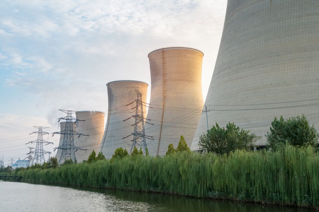 Nuclear power plant cooling towers and transmission lines, an industry served by Brilex manufacturing